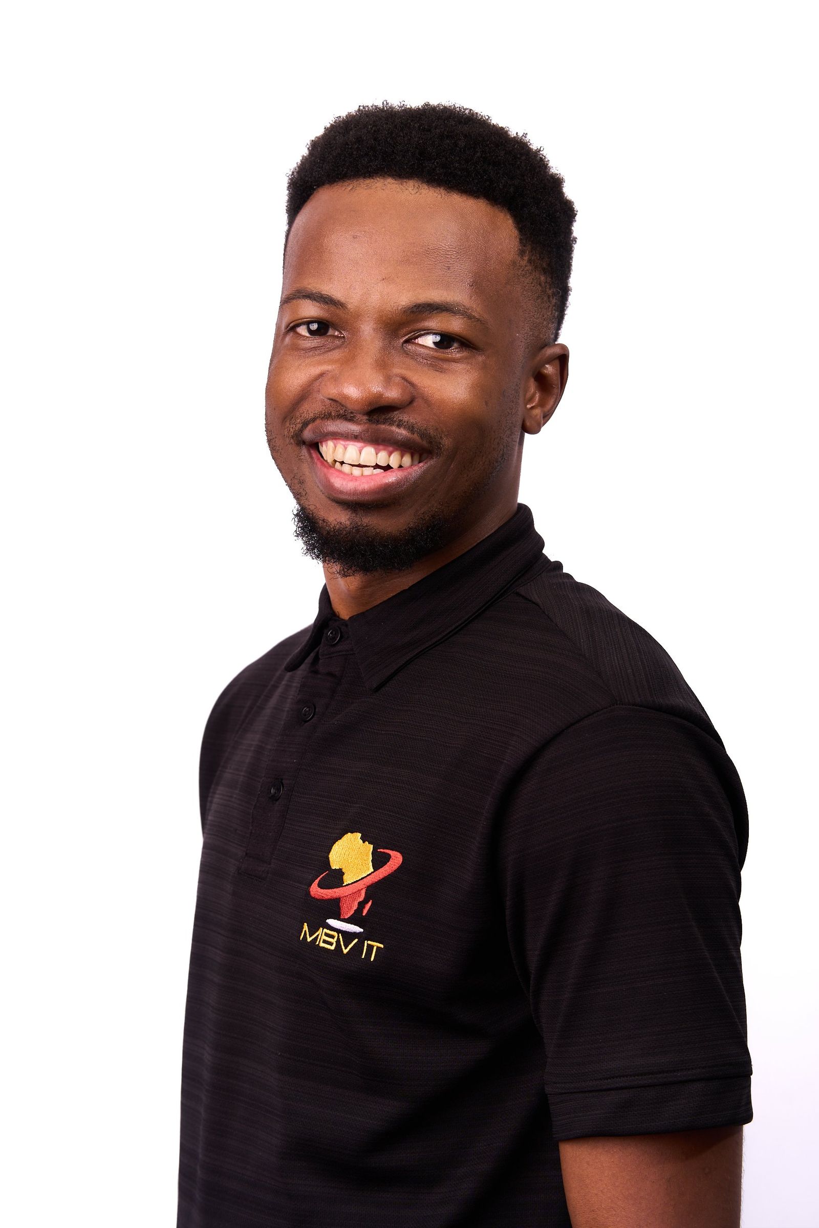 A staff portrait against a plain studio ground