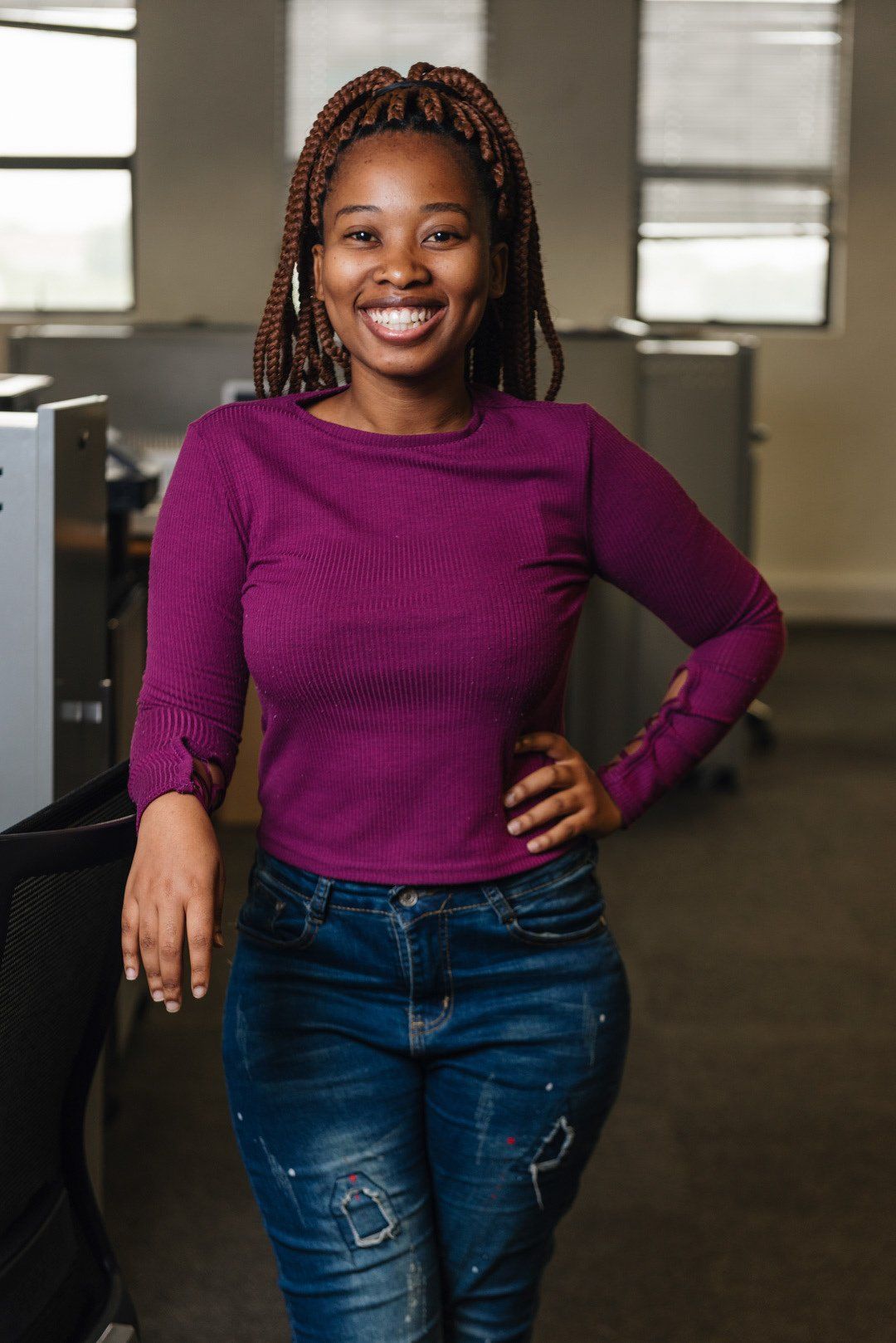 A Nestlé employee in a purple top, photographed for the recruitment campaign